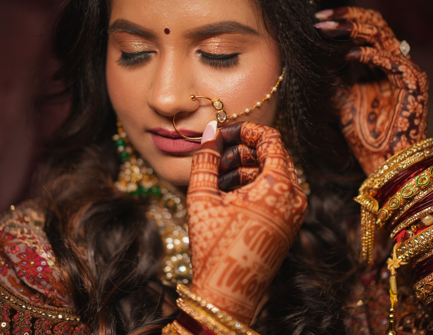 Bride adjusting her Nath